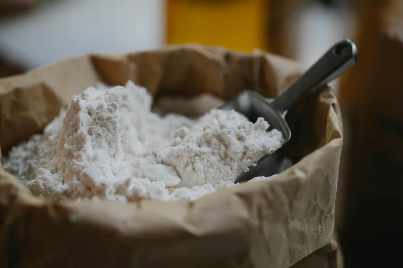 a bag of flour with a scoop in it, unsplash, beer, steroid use, pastry, te pae