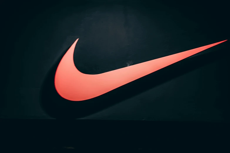 a red nike logo on a black background, by Niko Henrichon, trending on unsplash, 🦩🪐🐞👩🏻🦳, discovered photo, ad image, colored photo