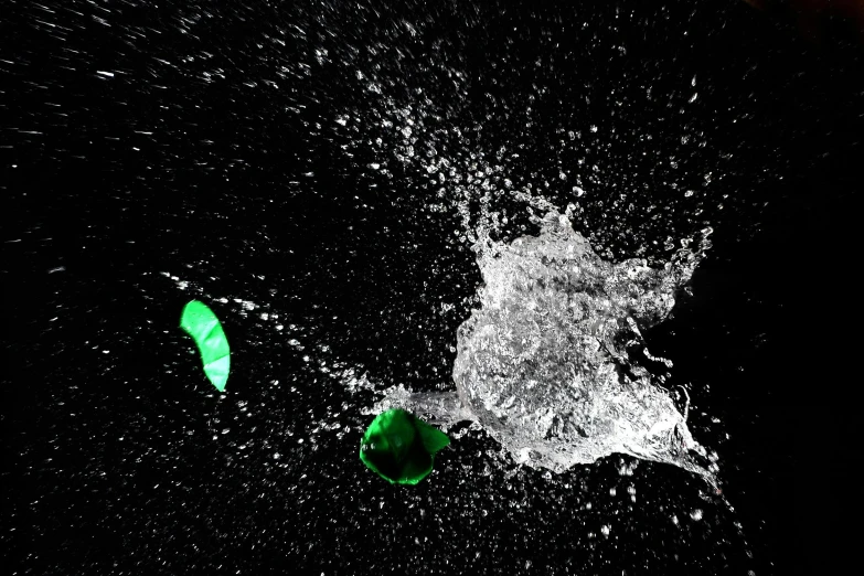 a bottle of beer is sprinkled with water, a raytraced image, inspired by Otto Piene, pexels, black and green, swimming, shot on sony alpha dslr-a300, jets