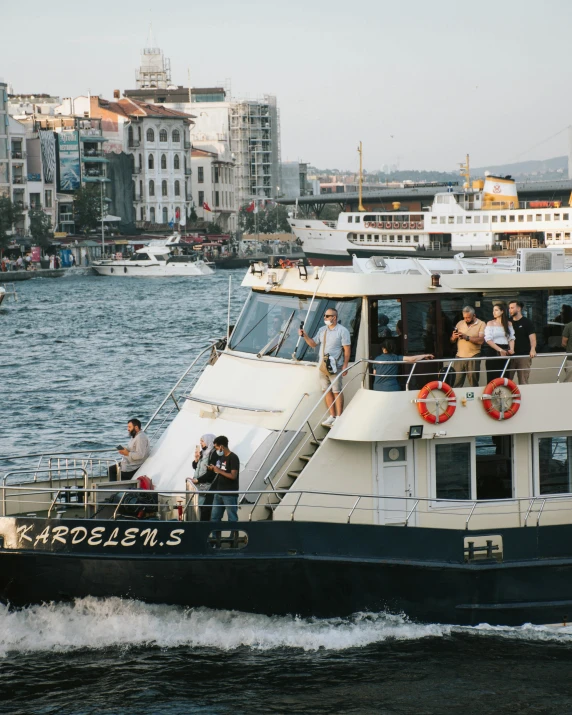 a group of people riding on the back of a boat, 🚿🗝📝, docked at harbor, lgbtq, istanbul