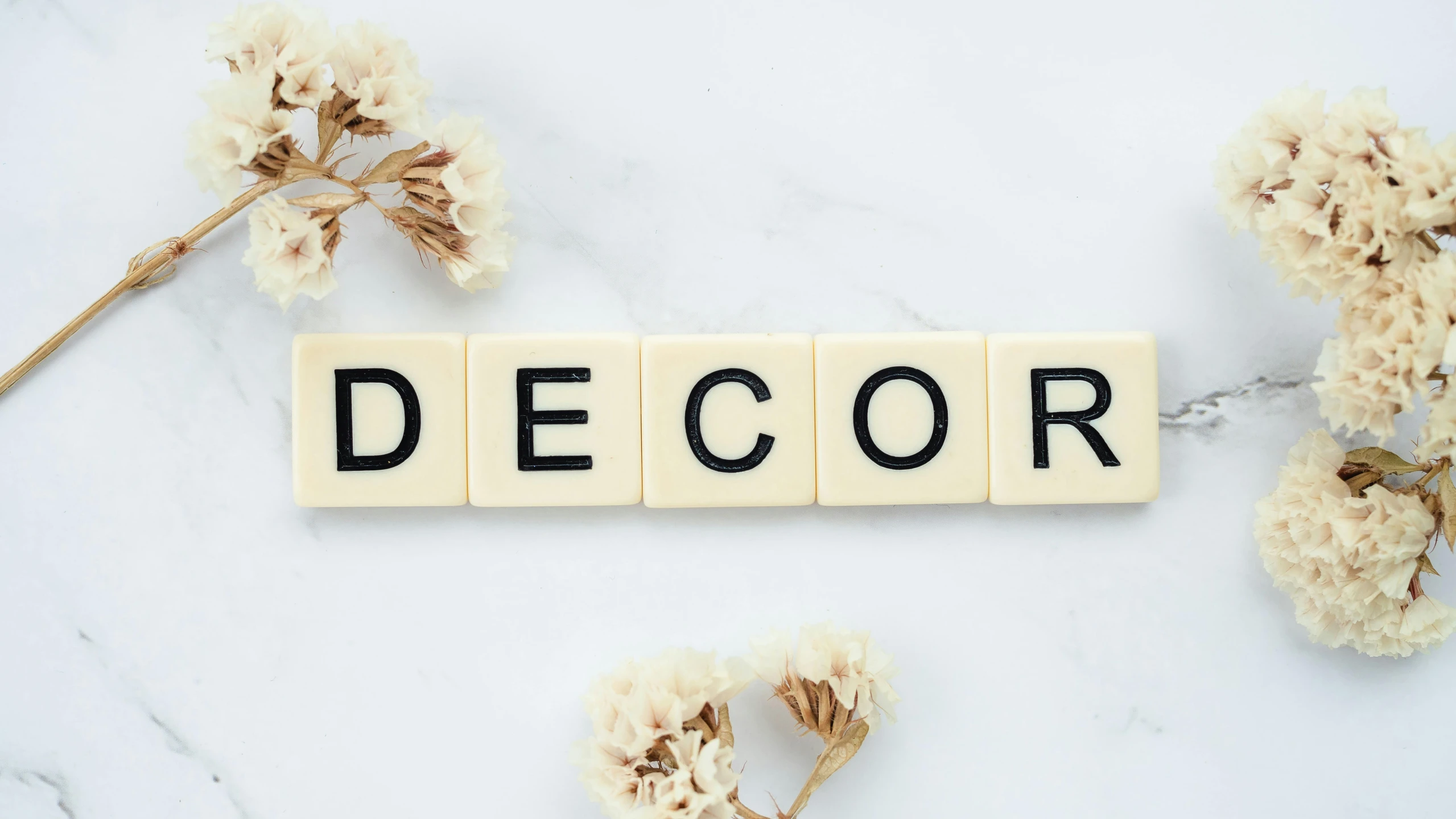the word decor spelled in scrabbles on a marble surface, featured on pinterest, rococo, discord profile picture, midsommar style, d. i. y. venue, gorecore