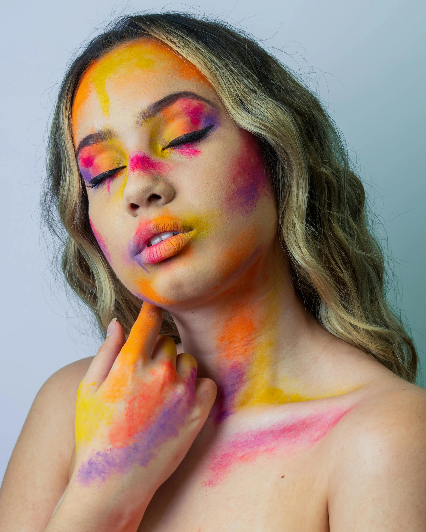a woman with colorful paint on her face, an airbrush painting, inspired by Bert Stern, trending on pexels, full body image, photoshoot for skincare brand, hand on cheek, pride month