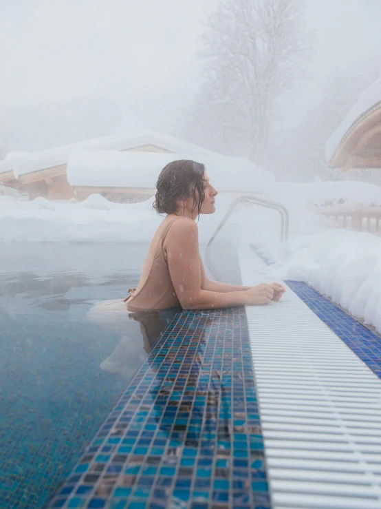a person sitting in a pool in the snow, covered in clouds, wellness pool, girl of the alps, profile image