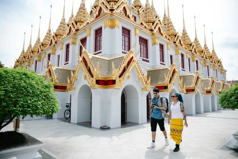 a couple of people that are standing in front of a building, a picture, thai temple, avatar image, raphael lecoste, square