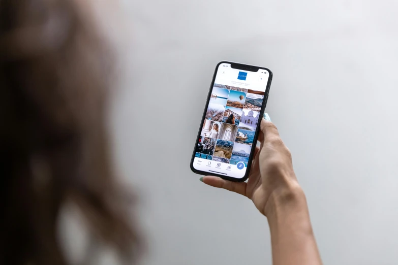 a close up of a person holding a cell phone, a picture, happening, profile image, instagram post, airbnb, high resolution