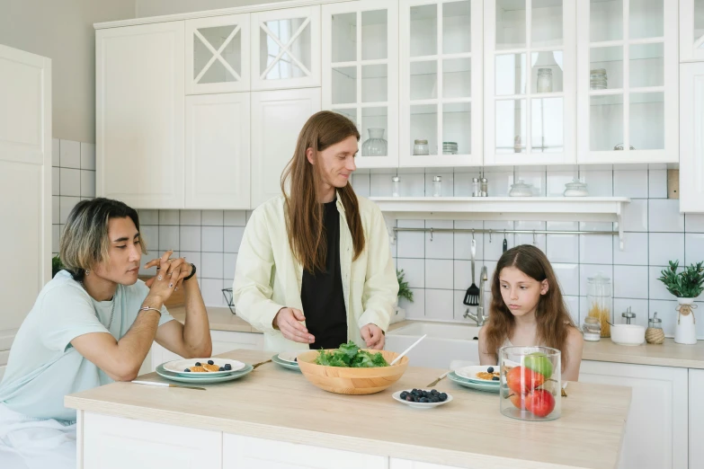 a group of people in a kitchen preparing food, on a white table, caring fatherly wide forehead, kirsi salonen, profile image