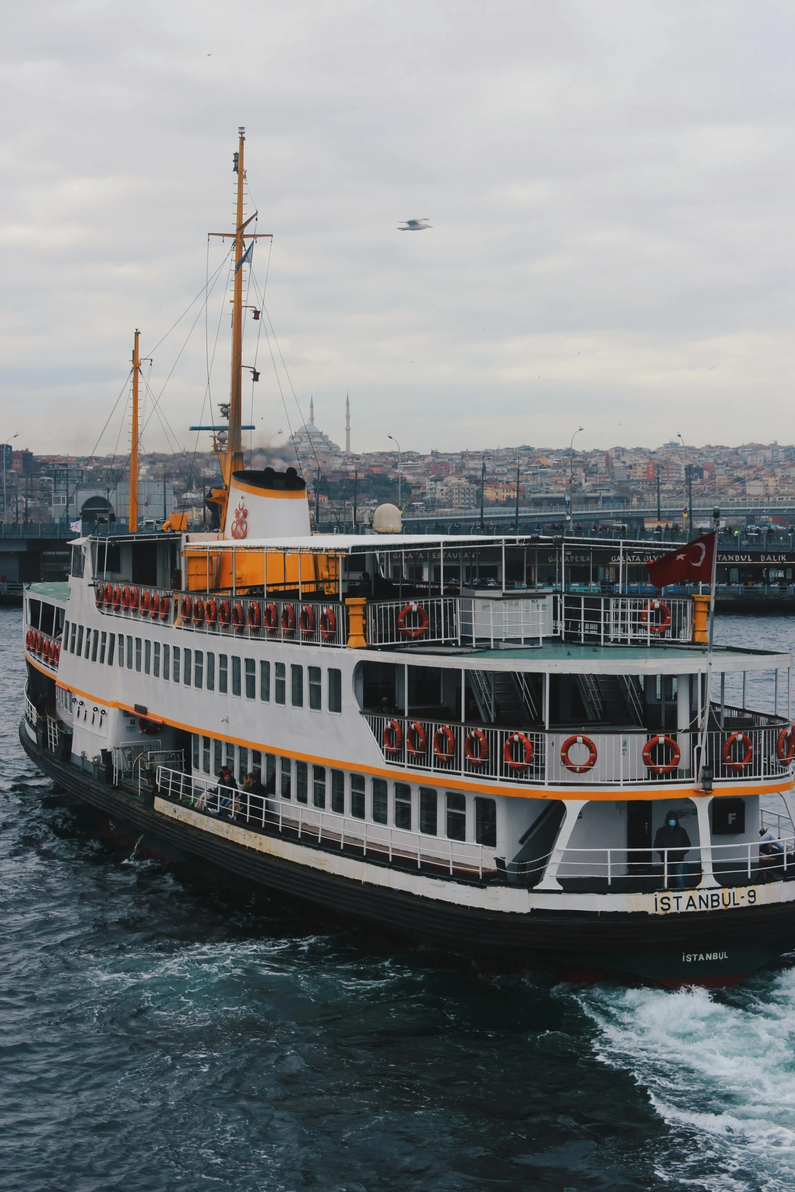 a large boat traveling across a body of water, by irakli nadar, istanbul, low quality photo, [ cinematic, stern