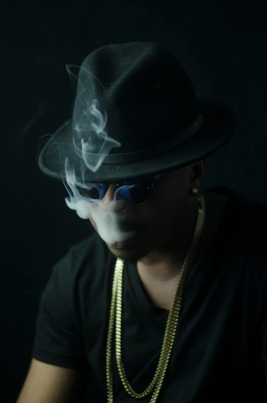 a man in a hat and sunglasses smoking a cigarette, an album cover, inspired by Zhu Da, unsplash, rapper bling jewelry, smoke :6, low key lighting, sittin