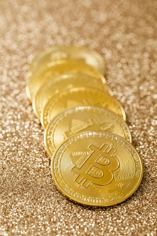 a pile of bitcoins sitting on top of a table, by Dan Content, renaissance, relaxed. gold background, thumbnail, glittering, seasonal