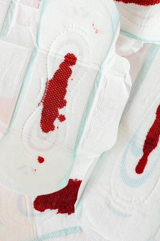 a pair of knee pads with blood on them, by Matija Jama, reddit, detail shot, made of lab tissue, murder scene, curved blades on each hand