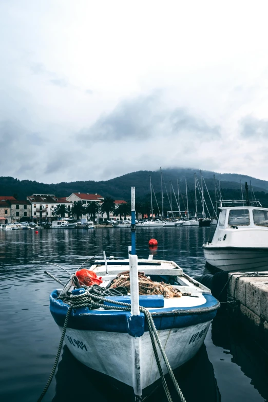 a couple of boats that are sitting in the water, by Matija Jama, happening, square, harbor, a cozy, boka