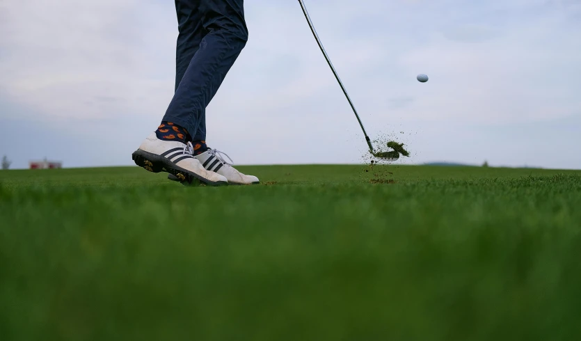 a person swinging a golf club at a golf ball, unsplash, sneaker photo, avatar image, slight overcast weather, thumbnail