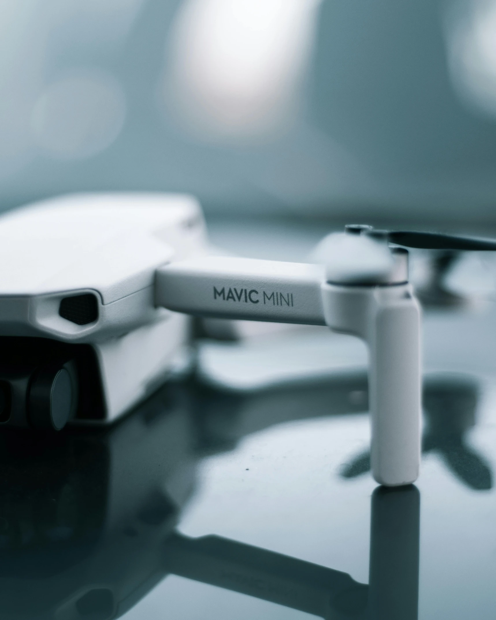 a small white drone sitting on top of a table, marc, lgbtq, thumbnail, mini model