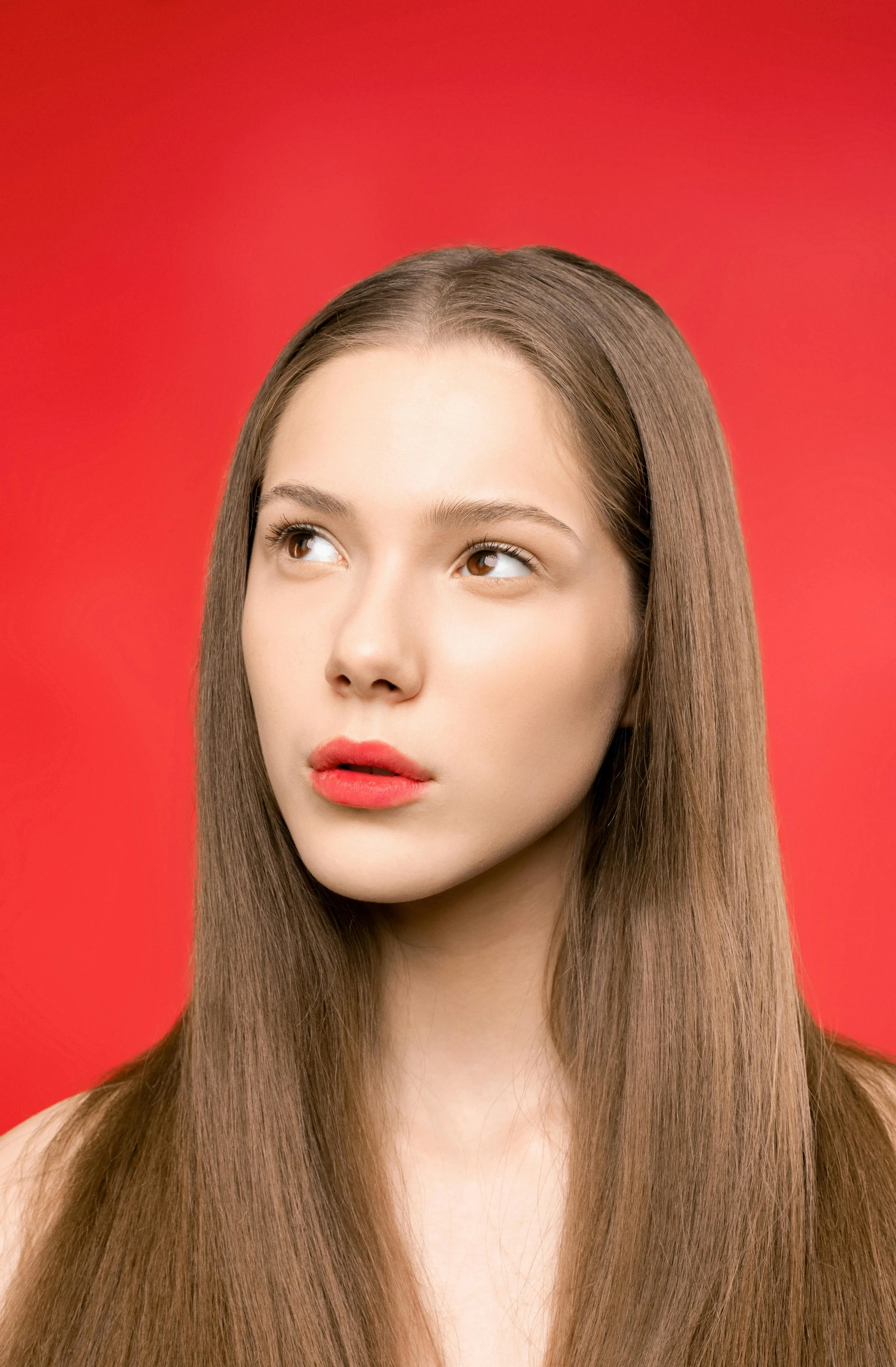 a woman with long brown hair on a red background, trending on pexels, coral lipstick, high resolution image, 5 0 0 px models, hyperrealistic teen