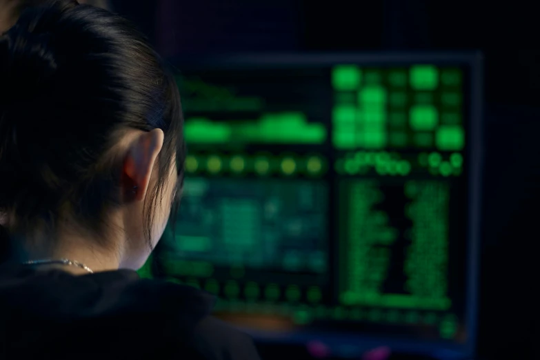 a woman sitting in front of a computer monitor, cyberwars, close up shot from the side, iu, cryptidcore