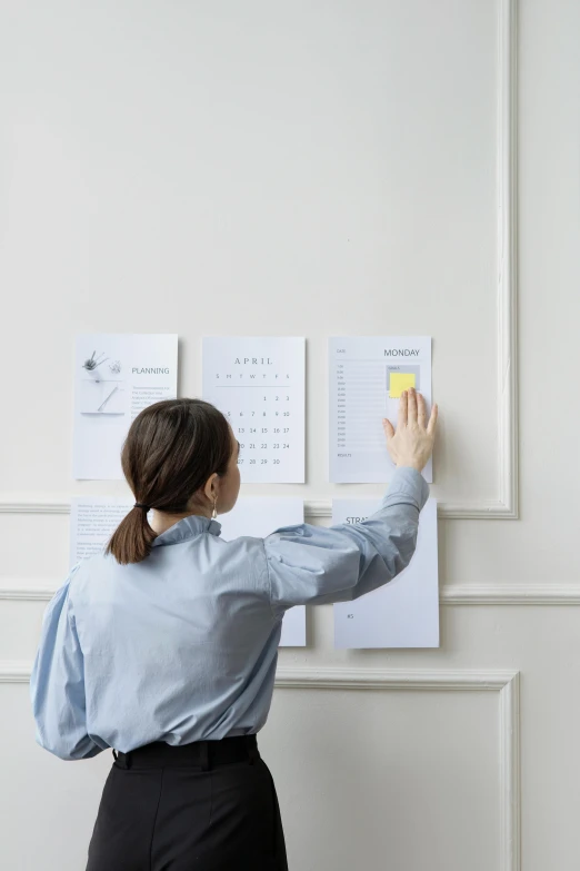 a woman standing in front of a wall with papers on it, reference sheet white background, home display, promo image, multiple stories