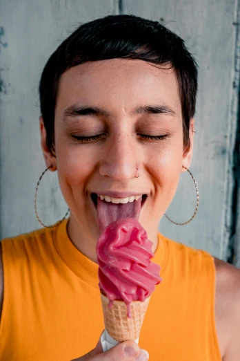 a woman is eating an ice cream cone, inspired by Elke Vogelsang, trending on pexels, raspberry banana color, latinas, androgynous face, shaven