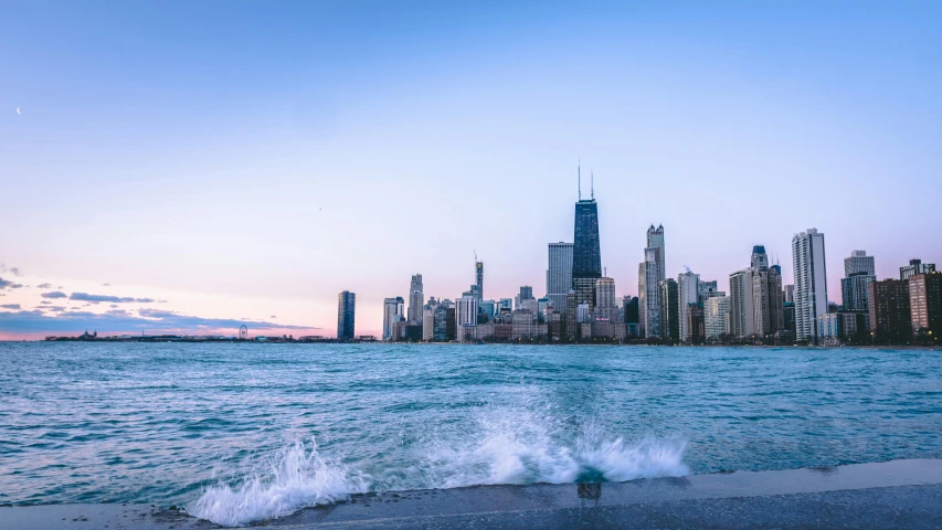 a large body of water with a city in the background, by Ryan Pancoast, pexels contest winner, from wheaton illinois, chillwave, shoreline, early evening