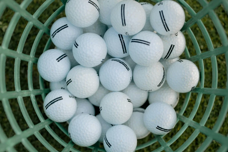 a green basket filled with white golf balls, by Joe Bowler, unsplash, avatar image, striped, ad image, high - detail