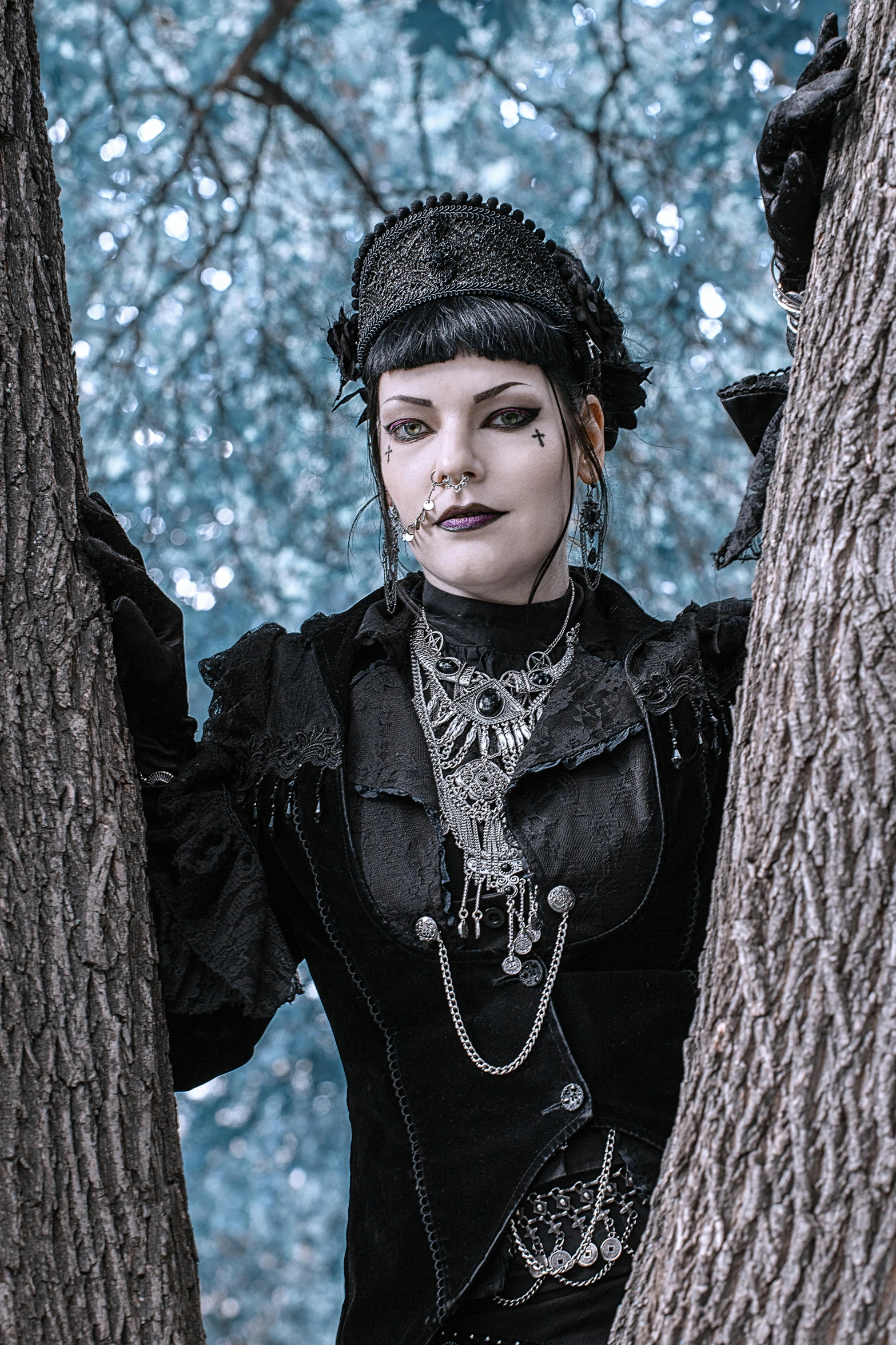 a woman in a black dress standing next to a tree, inspired by Rudolf von Alt, unsplash, gothic art, wearing steampunk attire, attractive androgynous humanoid, photograph of a techwear woman, pale gray skin