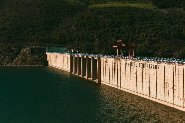 a large body of water with a dam in the background, by Elsa Bleda, pexels contest winner, renaissance, still from a wes anderson film, hydration, thumbnail, mechabot