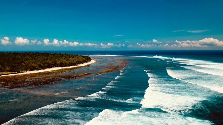 a large body of water next to a beach, hurufiyya, surfing, coral reefs, sarenrae, overview