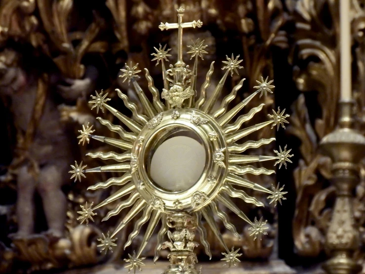 a golden chalicee sitting on top of a table, with a mirror, cathedral of sun, centered in a frame, photograph credit: ap