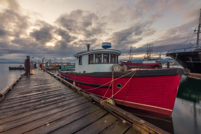 a red and white boat docked at a dock, by Brian Thomas, pexels contest winner, ballard, grey, warm glow, thumbnail