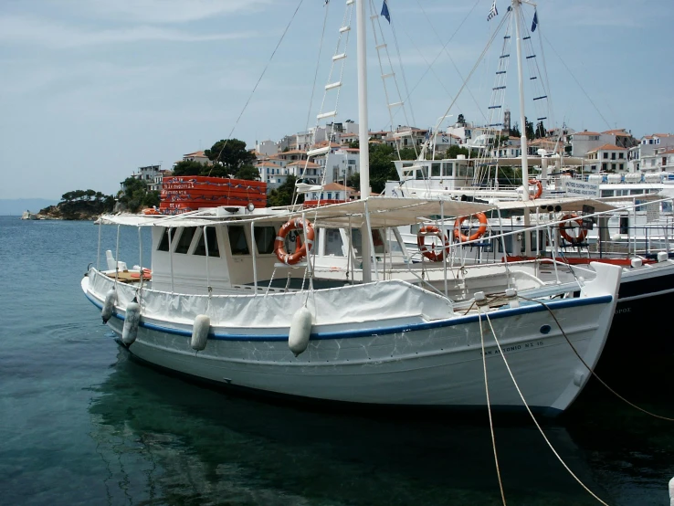 a couple of boats that are in the water, by Mathias Kollros, pexels contest winner, hurufiyya, hydra, white and orange, square, shiny crisp finish