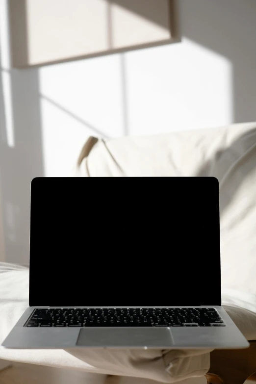 a laptop computer sitting on top of a white couch, pexels, hard backlight, black interface, someone in home sits in bed, promo image