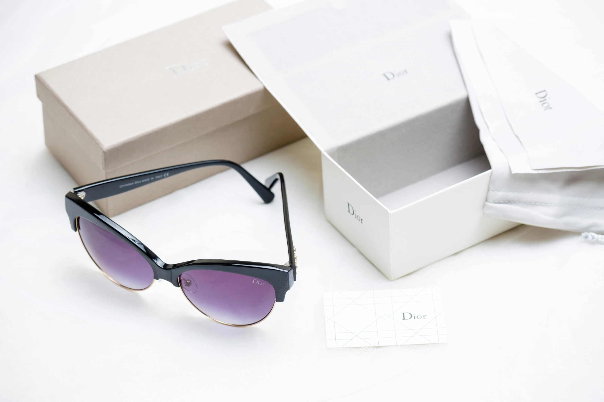 a pair of sunglasses sitting next to a box, dada, dior, ((purple)), thumbnail, lot of details