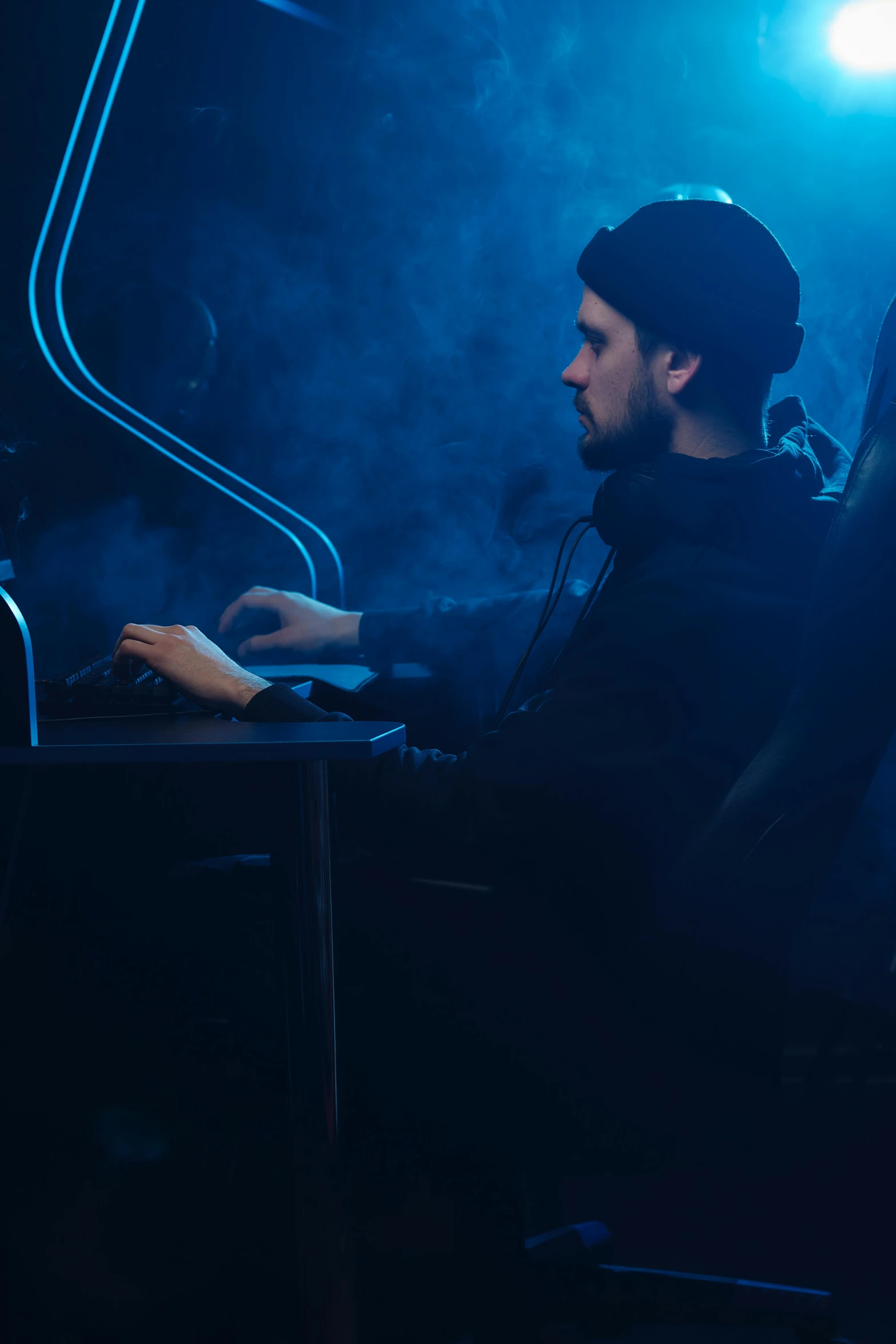 a man sitting in front of a laptop computer, by Adam Marczyński, featured on reddit, e-sport style, foggy dark, avatar image, long arm