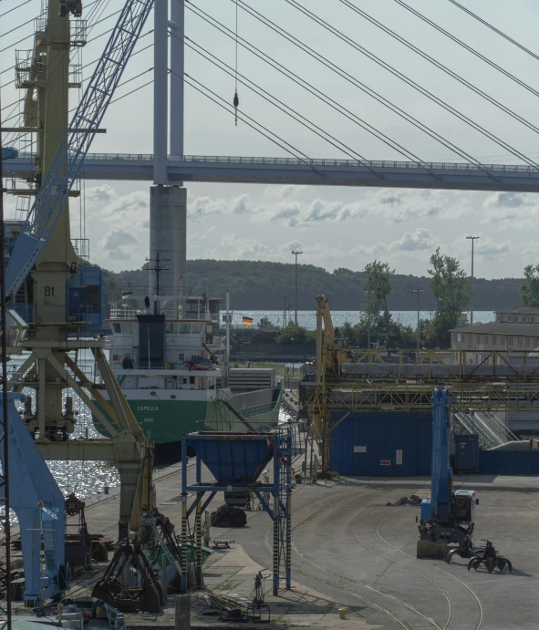 a large body of water with a bridge in the background, by Jan Tengnagel, happening, shipyard, thumbnail, overview, exterior shot