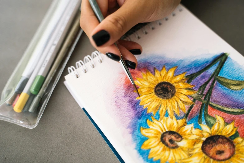 a woman is drawing sunflowers with colored pencils, a watercolor painting, by Julia Pishtar, trending on pexels, academic art, drawing pictures on a notebook, elaborate illustration, gouache 3 d shading, watercolors and acrylics