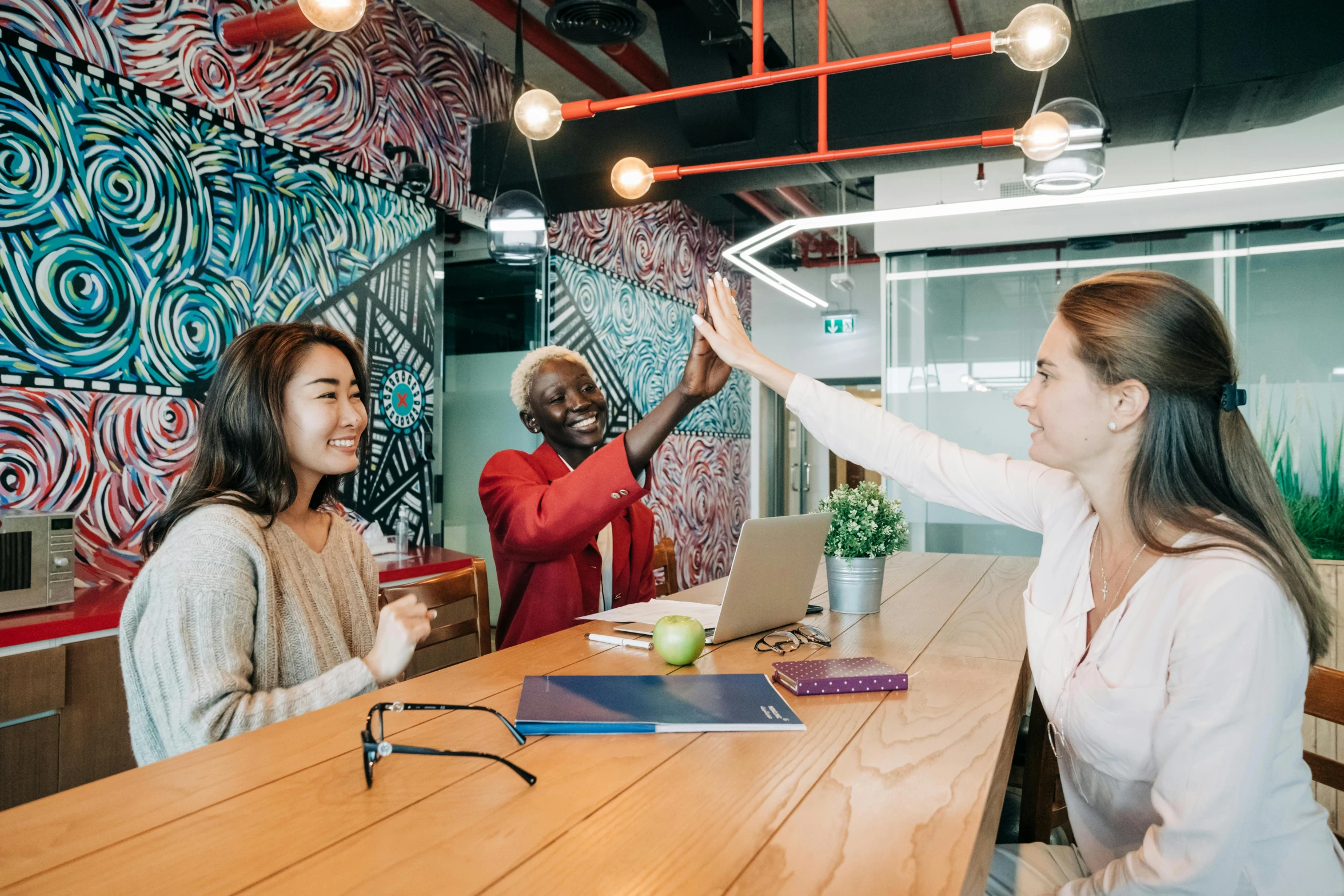 a group of women sitting around a wooden table, pexels contest winner, happening, office ceiling panels, greeting hand on head, 9 9 designs, coloured