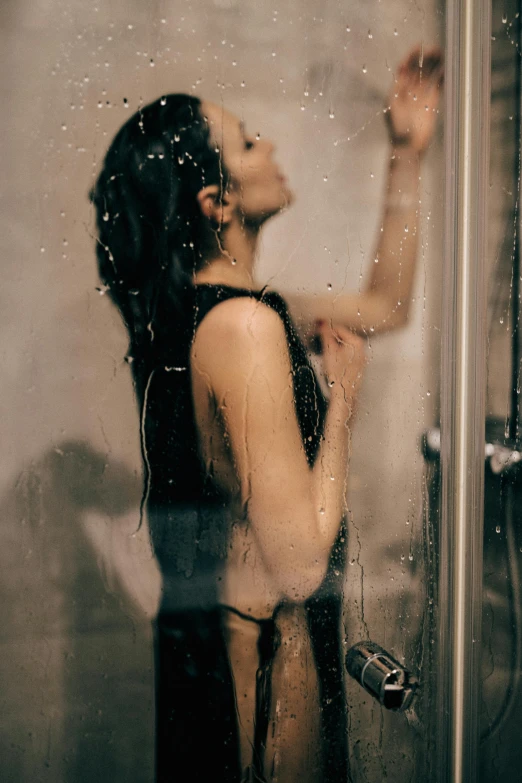a woman that is standing in a shower, inspired by Elsa Bleda, trending on pexels, 1614572159