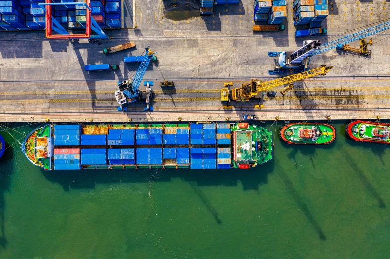 an aerial view of a cargo ship docked at a dock, pexels contest winner, inspect in inventory image, thumbnail, graphic print, 1 petapixel image