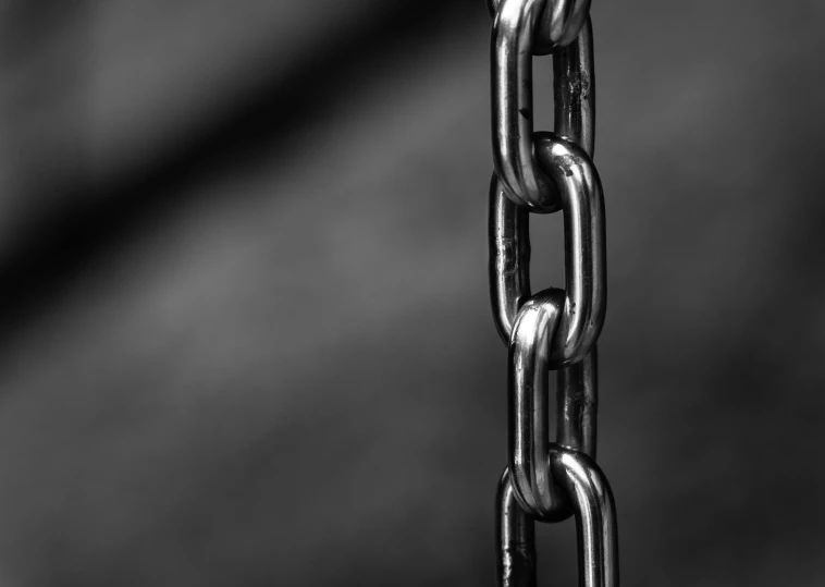 a black and white photo of a chain, by Kristian Zahrtmann, pexels, angular metal, depth map, vertical orientation, composite