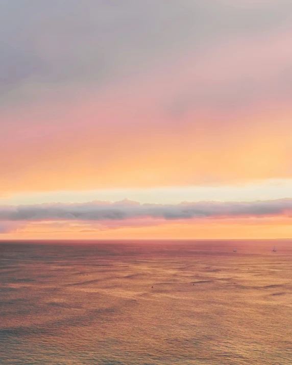 a large body of water with a sunset in the background, pexels contest winner, romanticism, fading rainbow light, soft light 4 k in pink, overlooking the ocean, today\'s featured photograph 4k