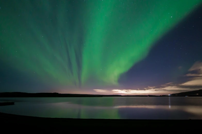 the aurora bore lights up the sky over a lake, a portrait, documentary photo, fan favorite, grey, aurora green