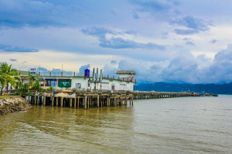 a pier in the middle of a body of water, by Joseph Severn, pexels contest winner, sumatraism, port scene background, background image, city of armenia quindio, ai weiwei and gregory crewdson