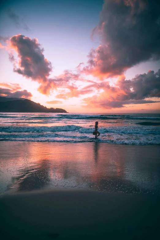 a person walking on the beach at sunset, unsplash contest winner, kauai, floating in the ocean, wellington, sunset with cloudy skies