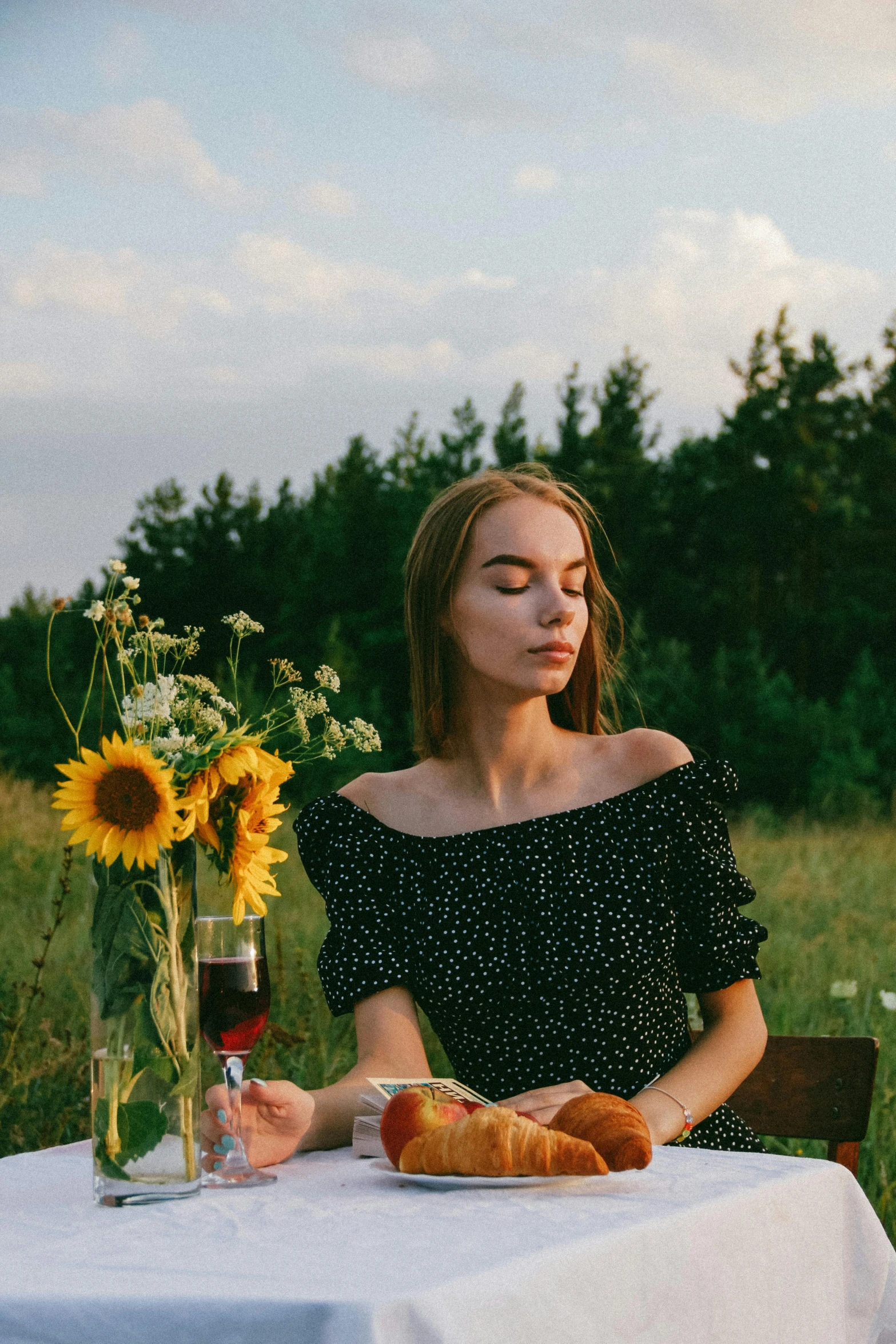 a woman sitting at a table with a plate of food, pexels contest winner, renaissance, sunflower field, handsome girl, forest picnic, thoughtful )