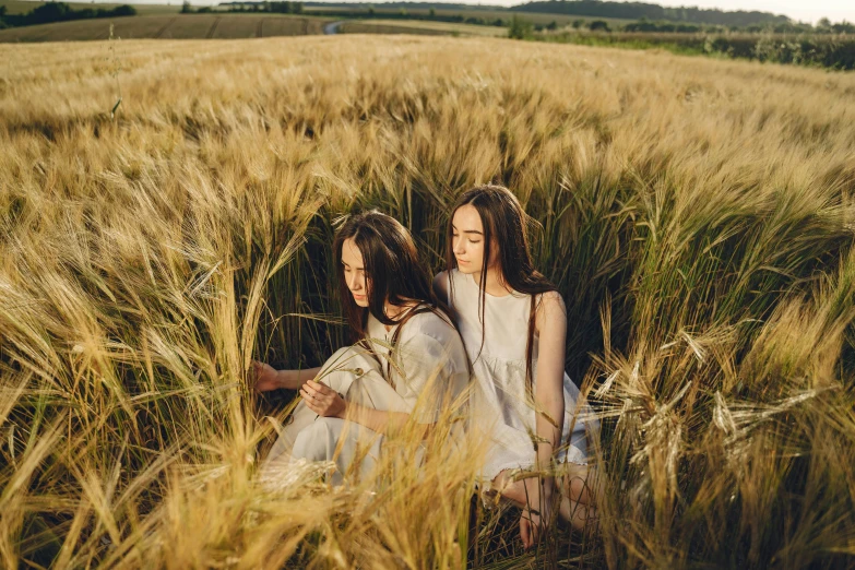 two girls sitting in a field of wheat, by Emma Andijewska, trending on pexels, surrealism, avatar image, natural skin, concert, 15081959 21121991 01012000 4k