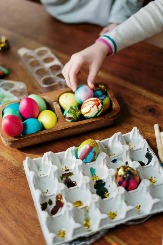 a close up of a tray of eggs on a table, a child's drawing, process art, decorated ornaments, wooden, thumbnail, mix