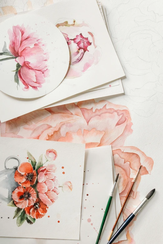 a bunch of cards sitting on top of a table, a watercolor painting, trending on pexels, peony, detailed product shot, half image, made of silk paper
