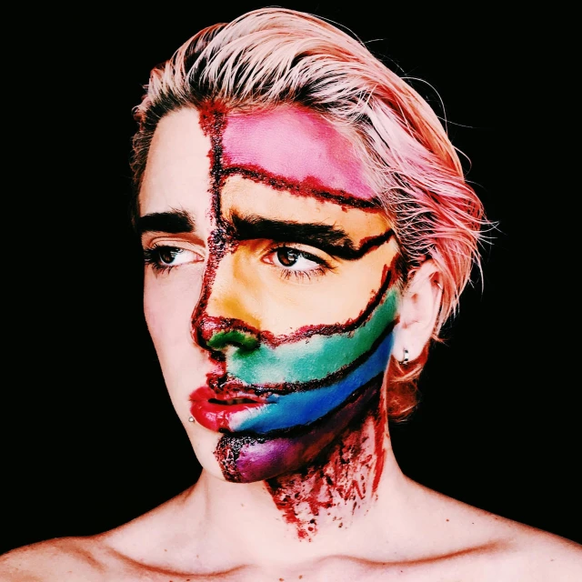 a close up of a person with a painted face, an album cover, by Olivia Peguero, trending on pexels, pop art, lgbt, robert sheehan, cracked body full of scars, androgyn beauty