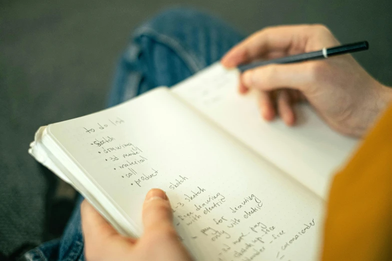 a person holding a pen and writing in a notebook, by Daniel Seghers, multiple stories, thumbnail, close full body shot, monthly