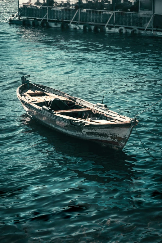 a small boat floating on top of a body of water, pexels contest winner, renaissance, battered, deep depth, rustic, highly polished