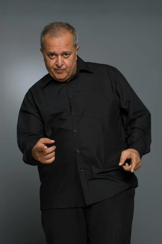 a man in a black shirt and black pants, les nabis, danny de vito, doing a sassy pose, bagdasarian productions, no text!